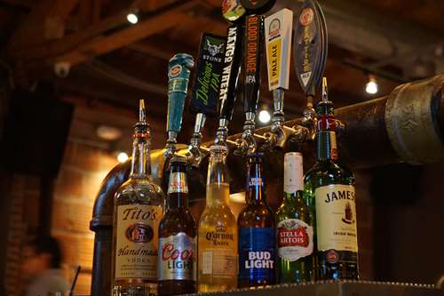 a variety of beer taps at the bar